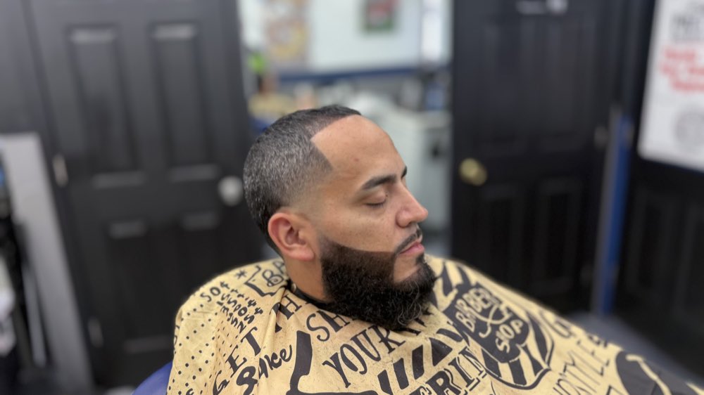 Textured haircut finish after barber service.