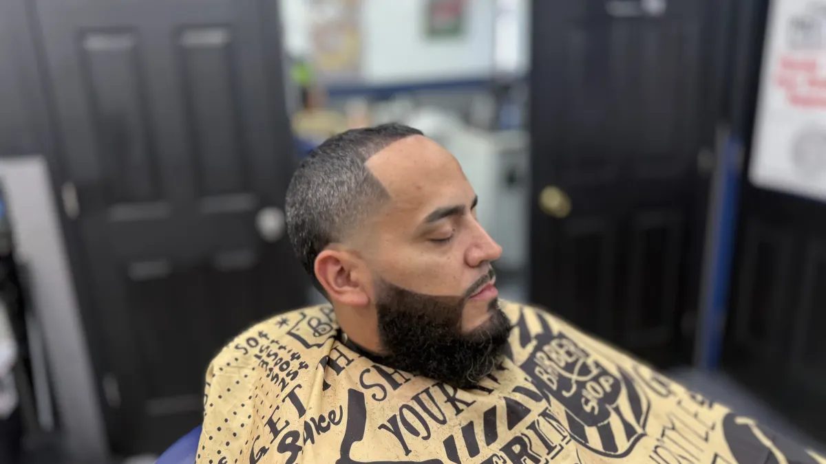 Close-up of a completed haircut and beard lineup result.